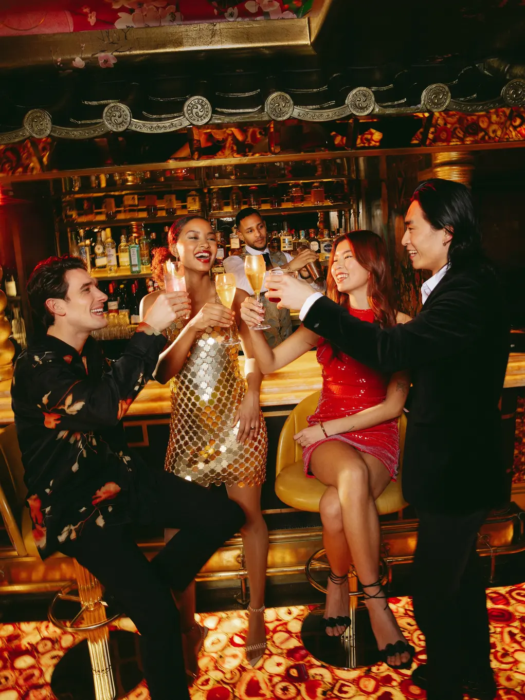 People cheering at a bar 